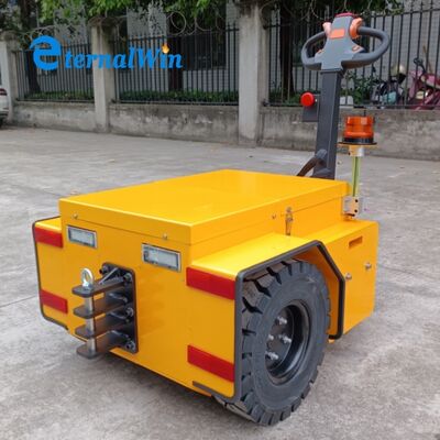 Carrello di traino manuale a batteria per movimentazione e trasporto industriale
